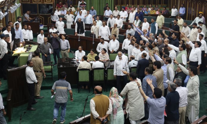 MLAs from both sides protesting in the Assembly on Wednesday. -Excelsior/Rakesh