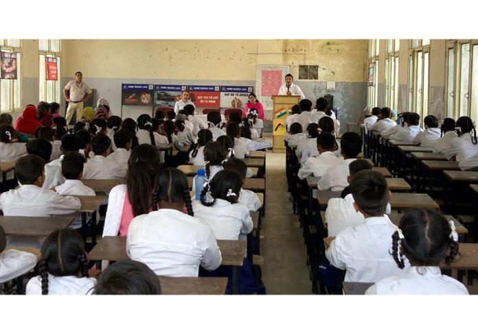 An ANTF officer addressing students of VK Sarvodaya Middle School.