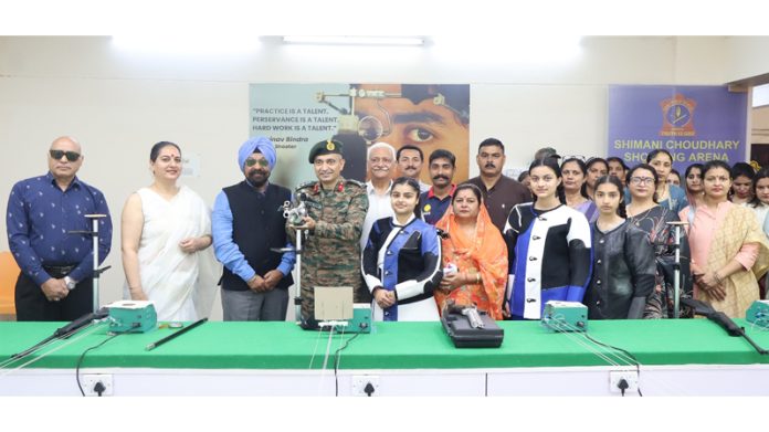 Dignitaries lighting lamp during a programme.