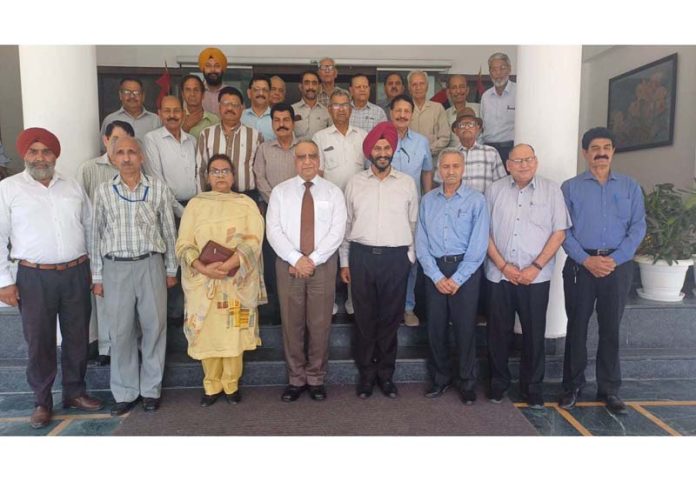 Retired police personnel posing for a group photograph after monthly meeting in Jammu on Monday.