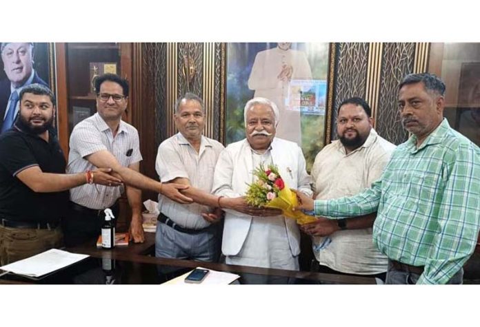 Gandhi Nagar Residents Welfare Association members during meeting with senior NC leader Ajay Sadhotra at party office in Jammu.