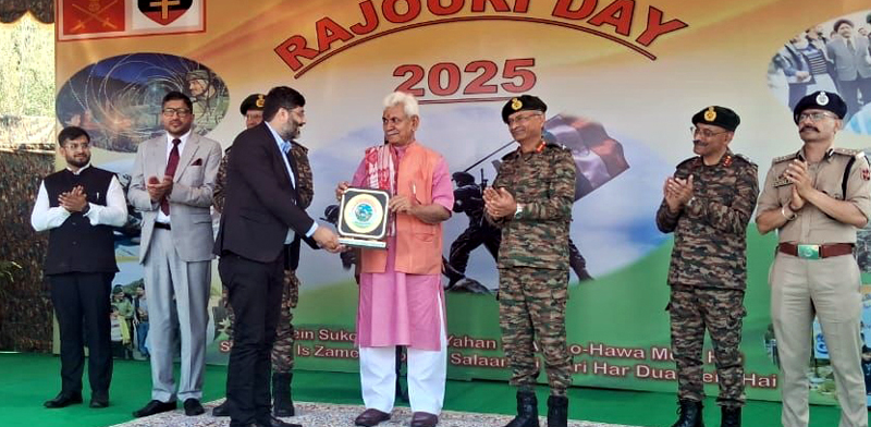 Ankush Sabharwal being felicitated by LG Manoj Sinha in Rajouri on Sunday.