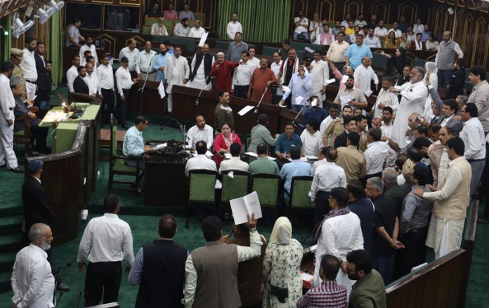 Ruling and Opposition MLAs protesting in the Assembly on Tuesday. -Excelsior/Rakesh