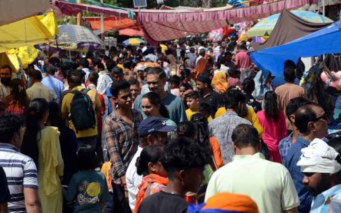Huge rush of people during the Baisakhi fair at Canal Head, Jammu on Sunday. -Excelsior/Rakesh