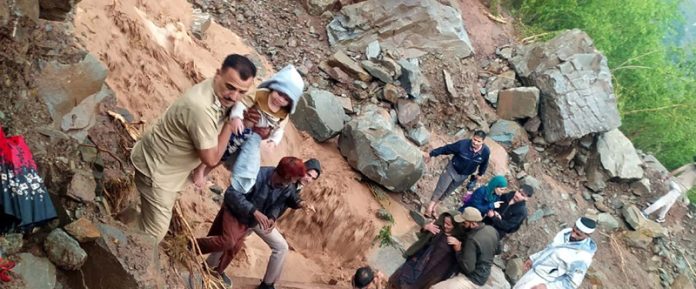 People being rescued by police & SDRF men in Ramban on Sunday. - Excelsior/Parvez