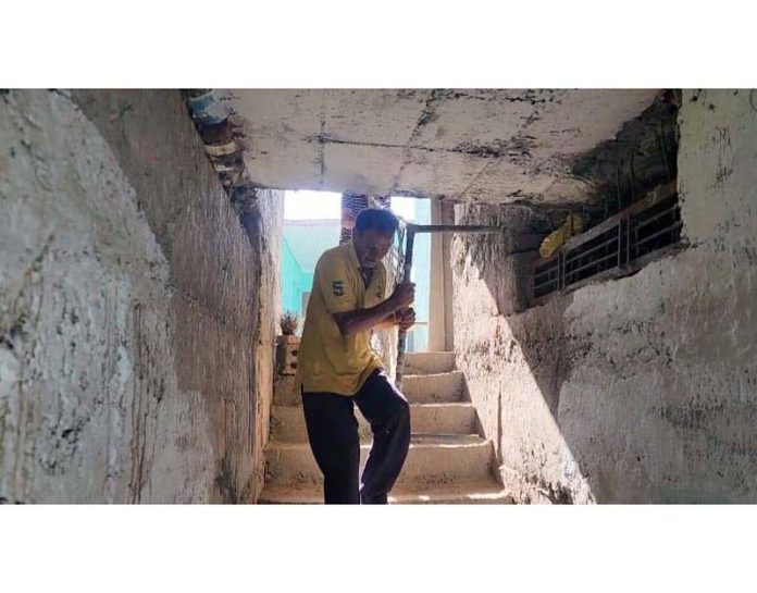 A bunker being cleaned by a villager in Khari Karmara area near LoC in Poonch. -Excelsior/Ramesh Bali