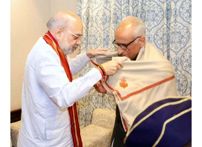 Home Minister Amit Shah meeting family member of the martyr DySP in Srinagar on Monday.