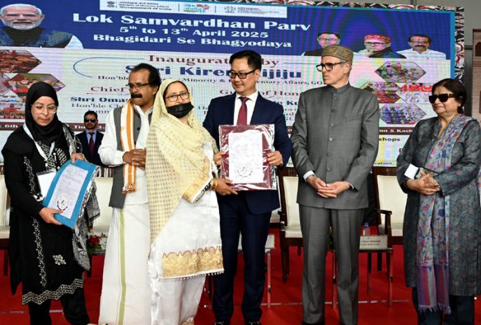 Union Minister Kiren Rijiju along with Chief Minister Omar Abdullah and other dignitaries during the inaugural ceremony of Lok Samvardhan Parv in Srinagar on Sunday. - Excelsior/Shakeel