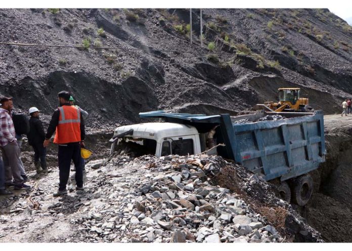 NH clearance & rescue work on in Ramban area on Monday.