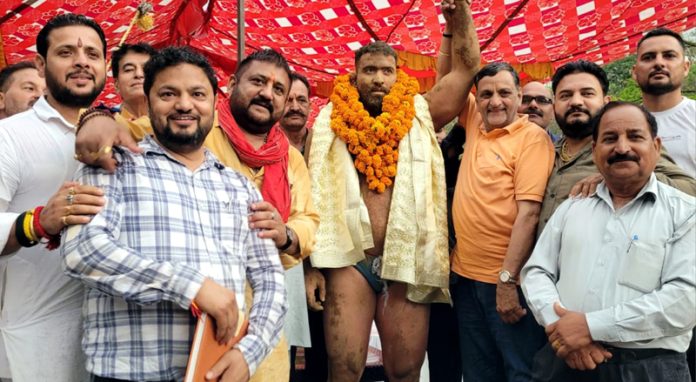 Dignitaries posing with winner Iranian wrestler in Reasi. Dignitaries posing with winner Iranian wrestler in Reasi.