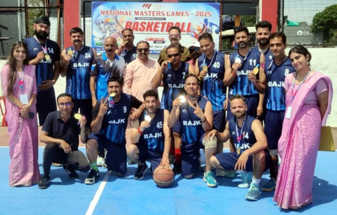 J&K Basketball teams posing with their coaches and mentors after winning medals in Masters National Games held in Dharamshala. J&K Basketball teams posing with their coaches and mentors after winning medals in Masters National Games held in Dharamshala.