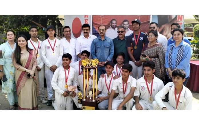 Dignitaries posing along with winning team during a tournament.