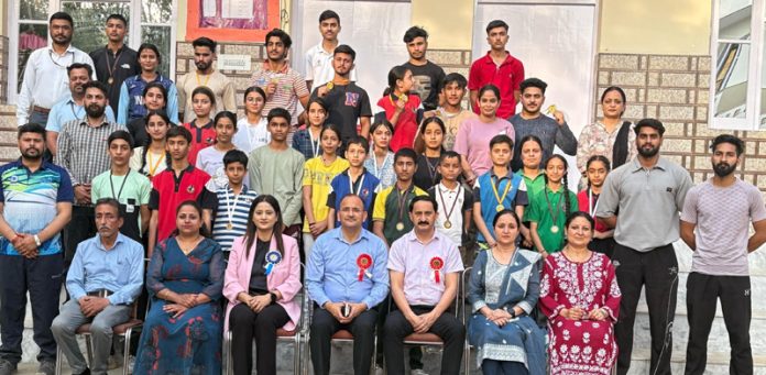 Dignitaries posing along with winners during District Sport Climbing competition.