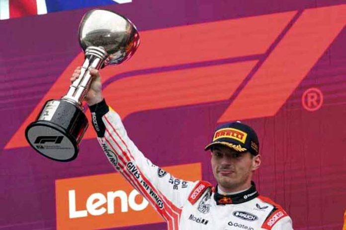 Max Verstappen of Red Bull holding Japanese Grand Prix trophy. Max Verstappen of Red Bull holding Japanese Grand Prix trophy.