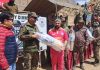 An Army officer presenting cricket kit to a player at Batalik during a programme.