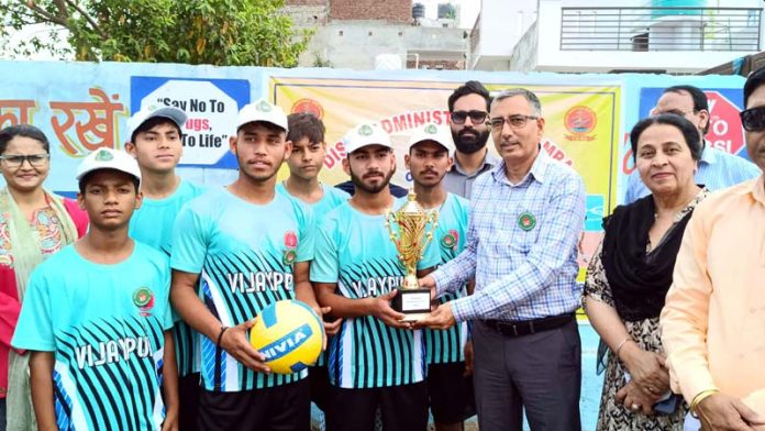 DC Samba, Rajesh Sharma honouring a winning Volleyball team with a trophy.
