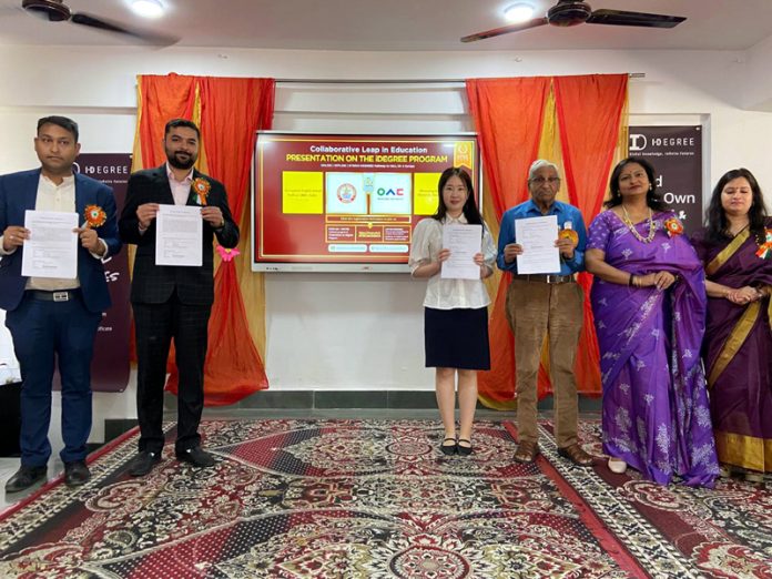 Representatives of Woosong University, South Korea and management of Spring Dales Kathua posing together with the signed MoU.
