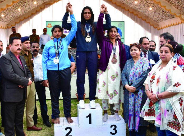 Dignitaries posing with winners on Day 3 of AIIU Powerlifting Championship at University of Kashmir.