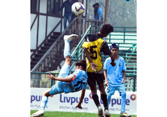 Football players in action during a match at TRC Ground, Srinagar. Football players in action during a match at TRC Ground, Srinagar.