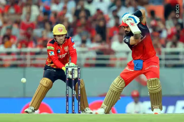 Virat Kohli playing cover drive during his inning of unbeaten 73 runs against Punjab Kings at Mullanpur on Sunday.