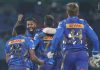 MI players celebrating after defeating Delhi Capitals at New Delhi on Sunday.