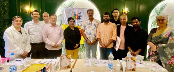 Master swimmers posing along with dignitaries during a programme. Master swimmers posing along with dignitaries during a programme.