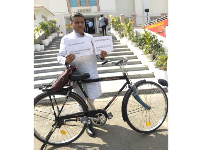 BJP MLA with bicycle outside Assembly complex. -Excelsior/Rakesh