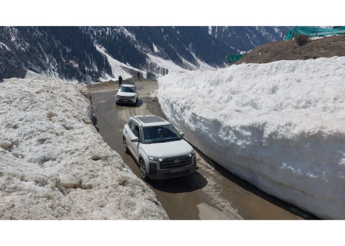 Vehicles plying on Sonamarg-Kargil Highway on Tuesday. —Excelsior/Firdous Vehicles plying on Sonamarg-Kargil Highway on Tuesday. —Excelsior/Firdous