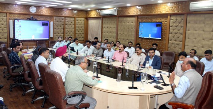 DyCM Surinder Kumar Choudhary chairing a meeting on Friday.