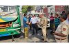 A team of RTO Jammu inspecting a mini-bus for overloading near Bikram Chowk, Jammu.