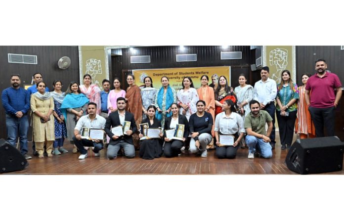 Winners of debate competition with guests and organizers of the event.