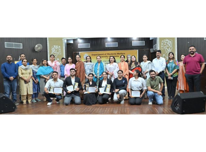 Winners of debate competition with guests and organizers of the event.