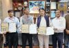 CEO Shrine Board and others displaying copies of MoU signed between THDCIL and GSI at Katra.