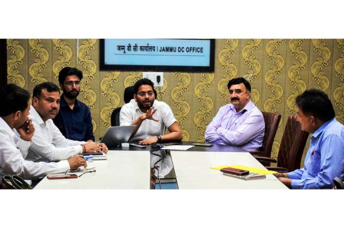 DC Jammu chairing a meeting on Tuesday.