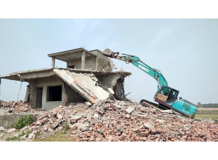 House of Lahu Gujar being demolished in Bishnah on Wednesday. -Excelsior/ Nischant