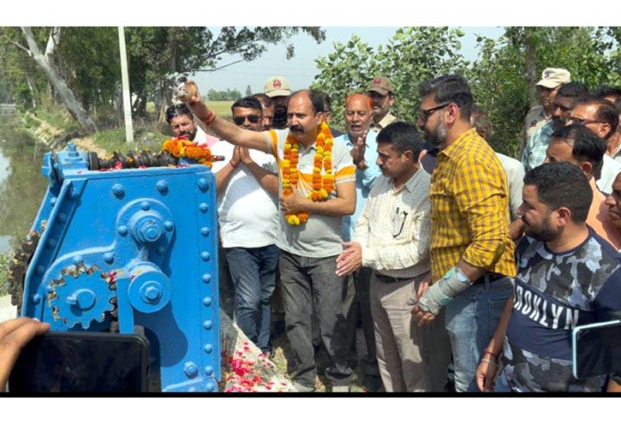 MLA Bishnah Dr RK Bhagat ceremoniously opening irrigation water at canal head, Pandorian (Bishnah).