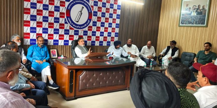 Syed Mohammad Altaf Bukhari chairing a party meeting in Jammu on Saturday.