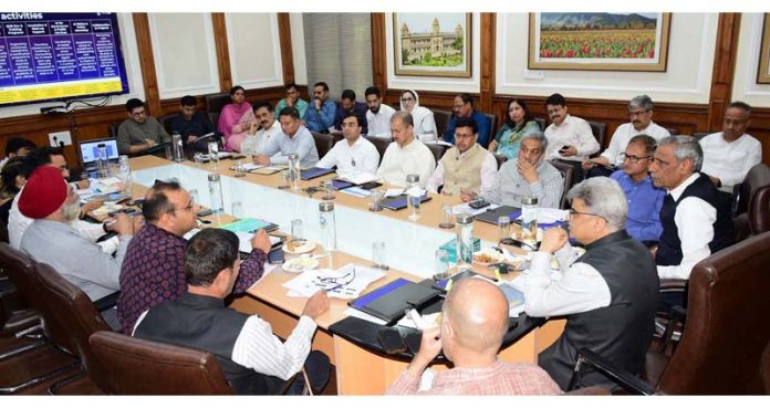Chief Secretary chairing a meeting at Jammu on Friday.