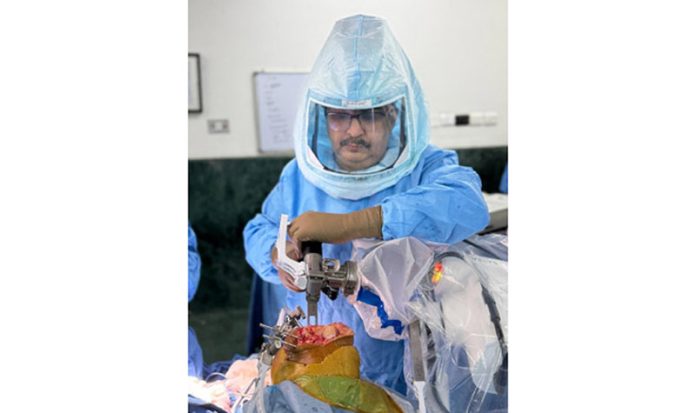 Dr Mohit Arora performing robotic knee replacement surgery on a patient. Dr Mohit Arora performing robotic knee replacement surgery on a patient.