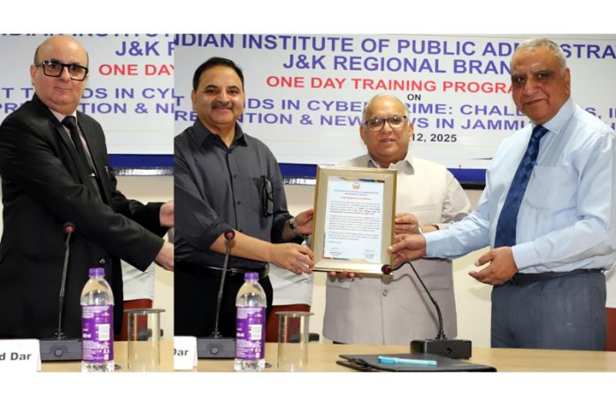 B R Sharma and Ashok Bhan honouring resource persons during training programme by IIPA.