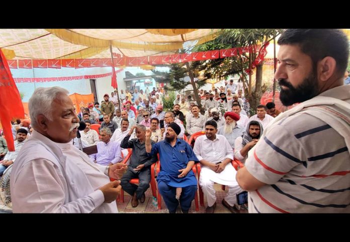 Former minister Ajay Sadhotra addressing public meeting at Marh on Thursday.