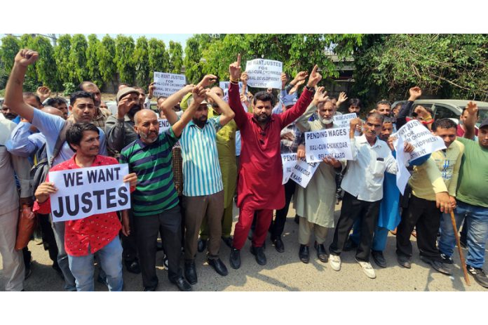Malis cum Chowkidars of RDD raising slogans during a protest in Jammu on Tuesday. — Excelsior/Rakesh
