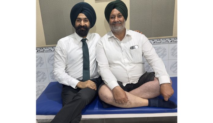 Dr Ranjit Singh posing with a patient on whom he performed a complex bilateral knee replacement surgery.
