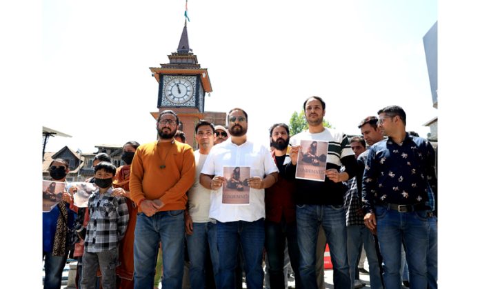 PM package employees staging protest at Srinagar’s iconic Clock Tower on Thursday. -Excelsior/Shakeel PM package employees staging protest at Srinagar’s iconic Clock Tower on Thursday. -Excelsior/Shakeel