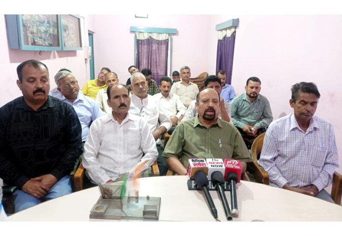 PHE employees leader Som Nath addressing a press conference at Udhampur on Saturday.
