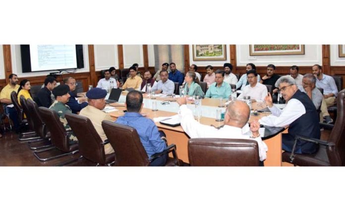 CS Dulloo chairing a meeting at Jammu on Friday. CS Dulloo chairing a meeting at Jammu on Friday.