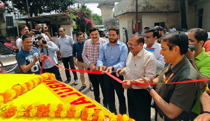 DC Jammu Sachin Kumar Vaishya cutting ribbon during handing over ceremony of two ambulances to SMGS Hospital, Jammu.