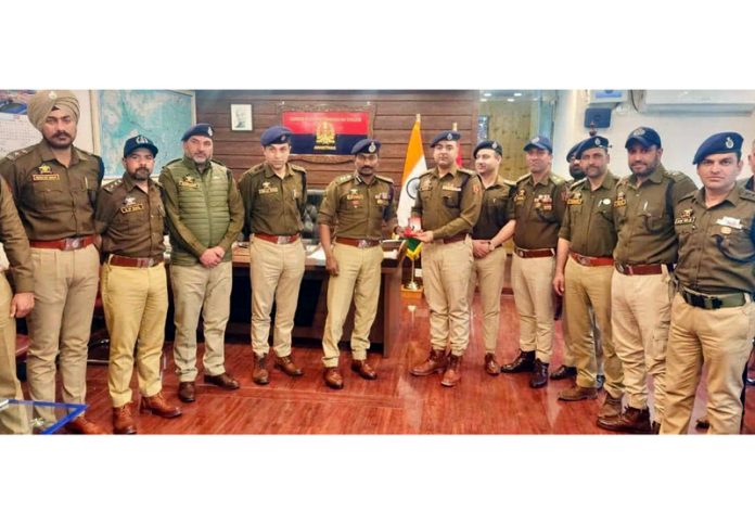 SSP Anantnag Dr G V Sundeep Chakravarthy, DySP Saqib Ghani, and other police officers at DPO Anantnag.