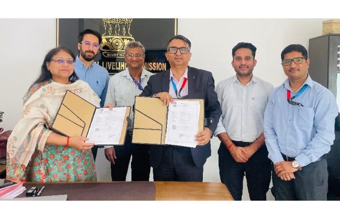 MD JKRLM Shubra Sharma along with J&K Bank's DGM Rakesh Magotra and other officers during signing of an MoU.