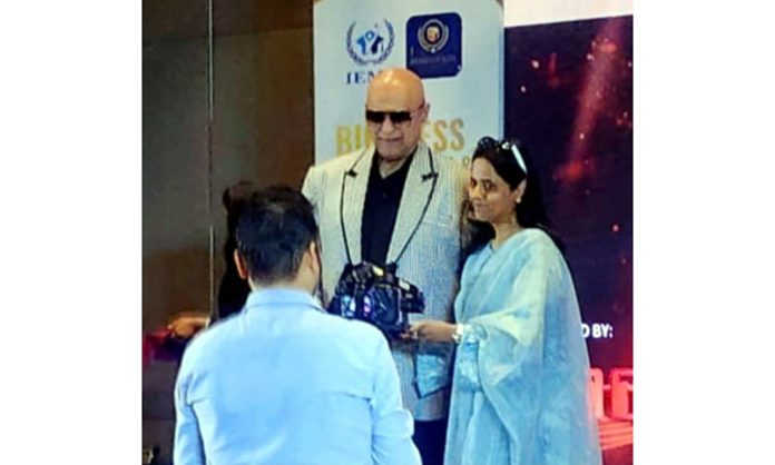 Varsha Bansal receiving an award during a function held on Friday.